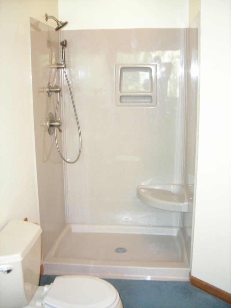 A Bathroom with A Toilet a Shower and A Sink — Columbia, MO — Naugle Construction Company