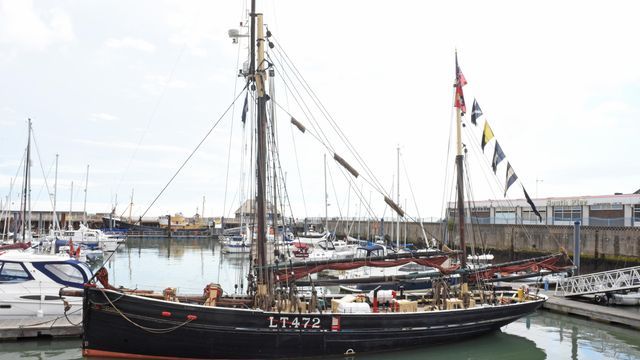 The histsoric smack race festival in Lowestoft proudly shows Excelsior bedecked with flags and bunting