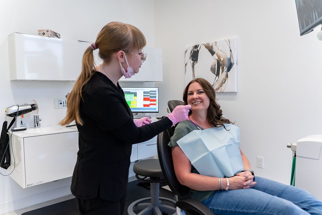 Dentist welcoming a patient before a routine dental examination in a modern treatment room