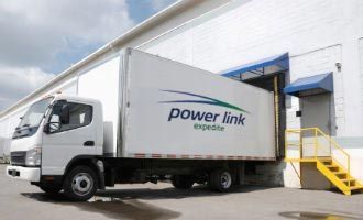 White Power Link expedite truck backed into loading dock.