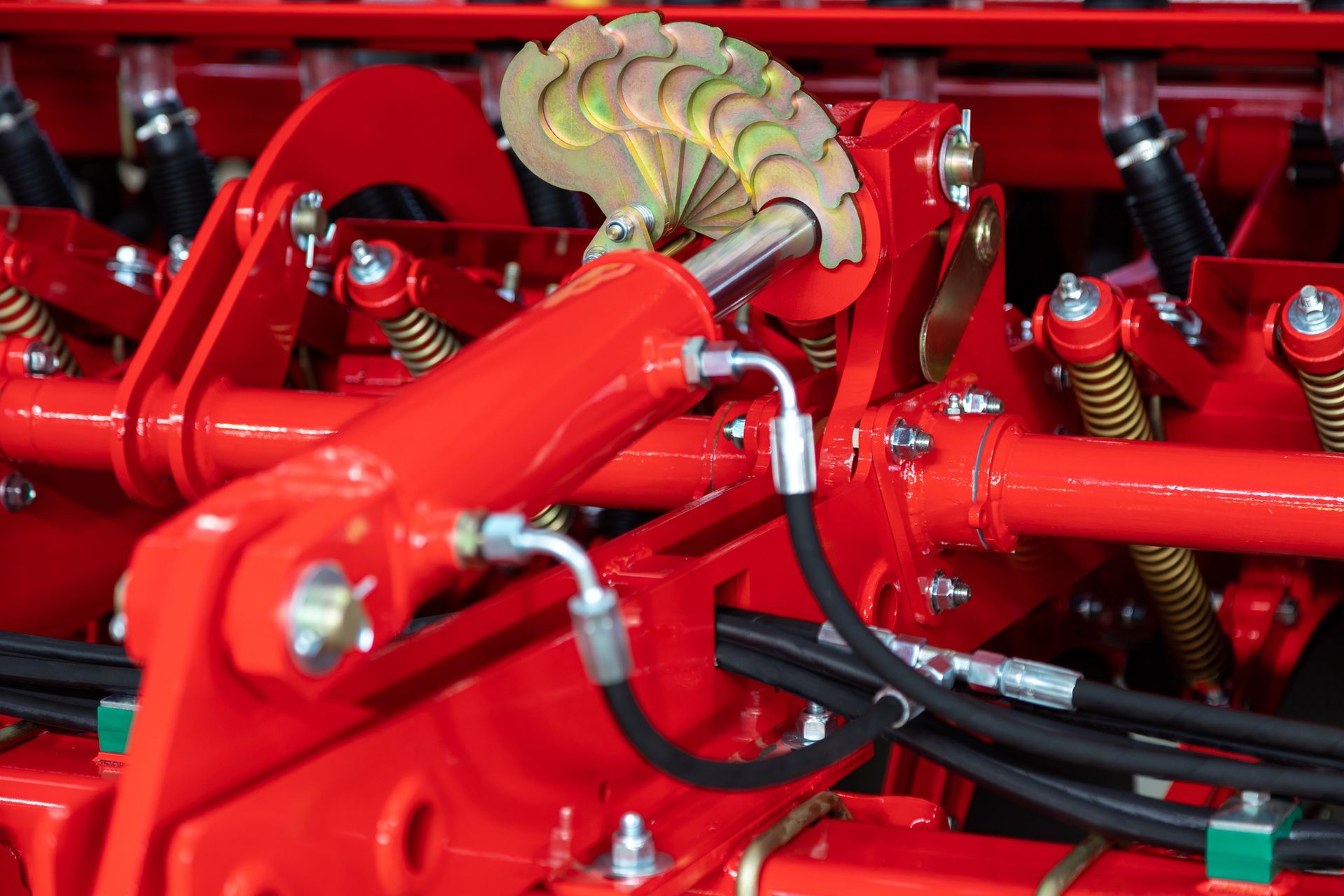 Hydraulic unit with a piston in an agricultural machine.