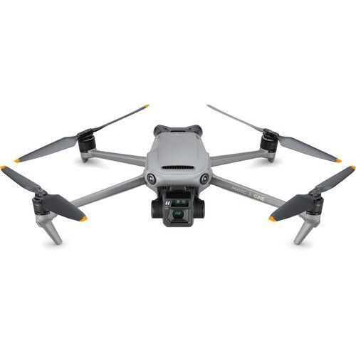 Gray drone with four propellers, black camera, pointed toward the viewer.