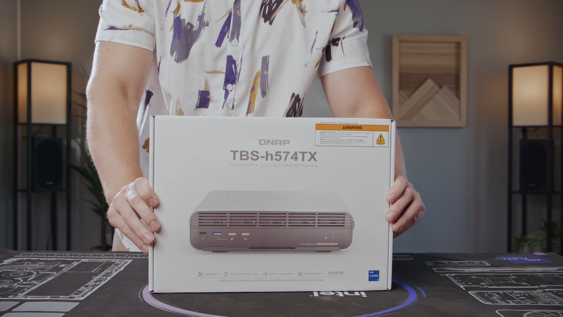 CineSalon CEO, Shane Yeager shows off the new QNAP TBS-h574TX NASbook in its creative packaging