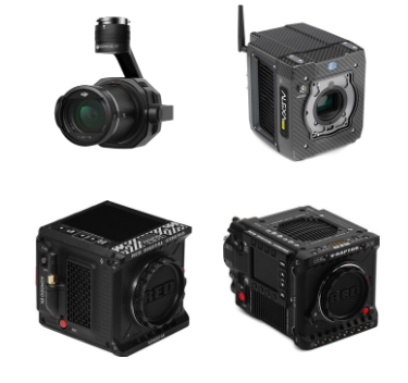 Four professional digital cameras of different sizes and designs.