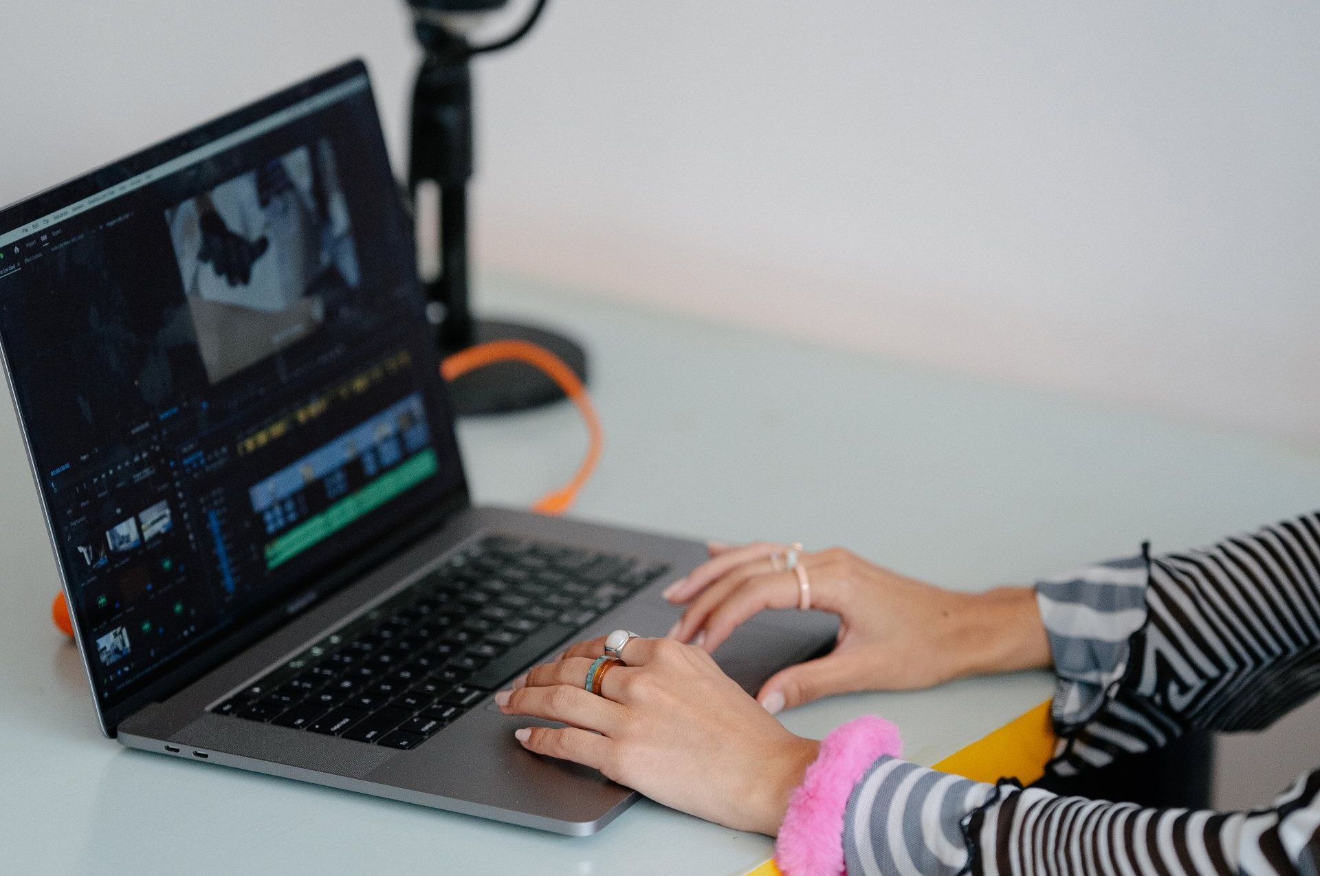 A person is typing on a laptop computer.
