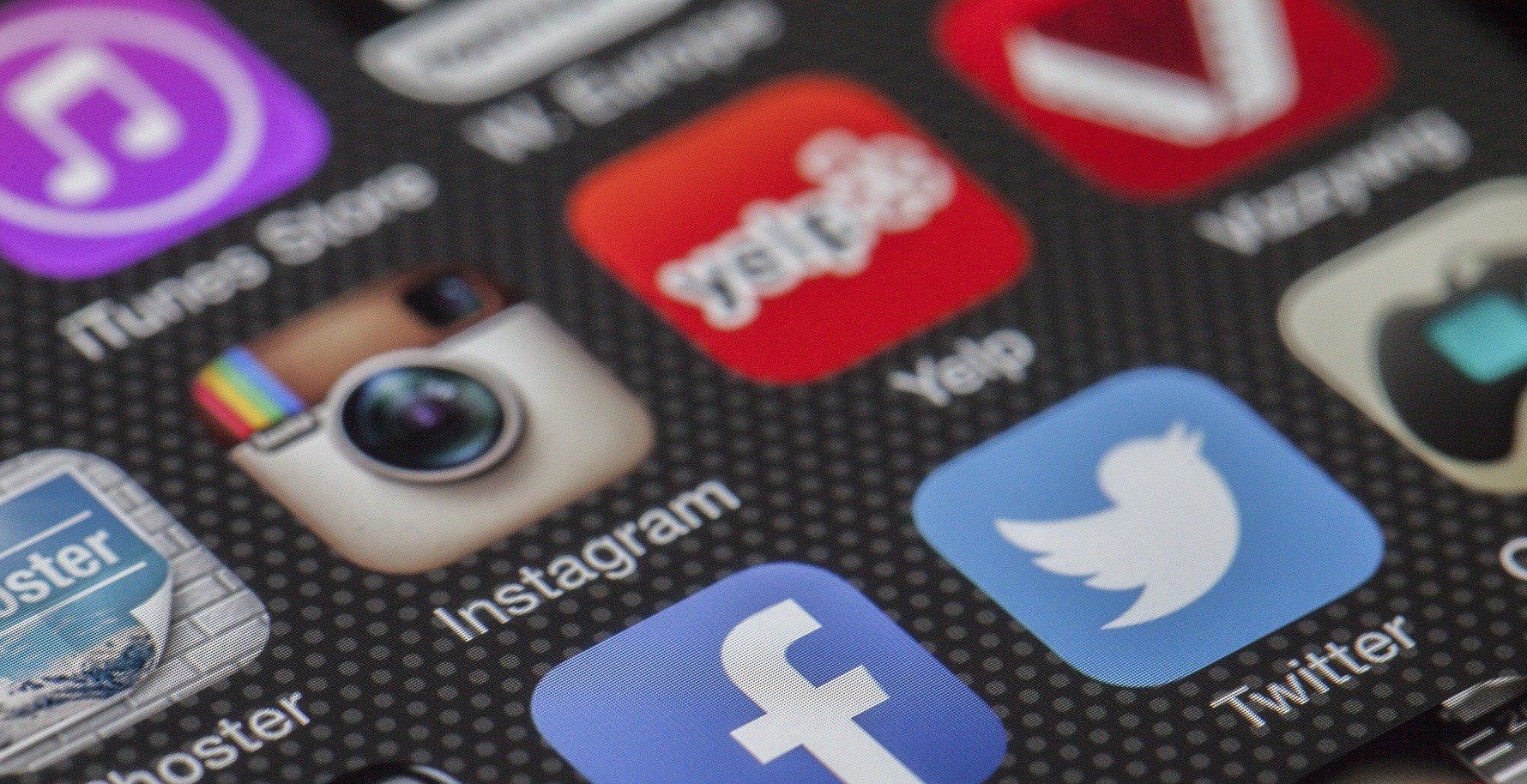 A close up of a cell phone screen with social media icons