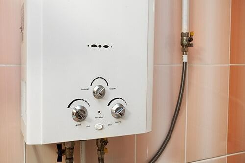Gas Water Heater in the Kitchen — Hot water system in Armidale, NSW