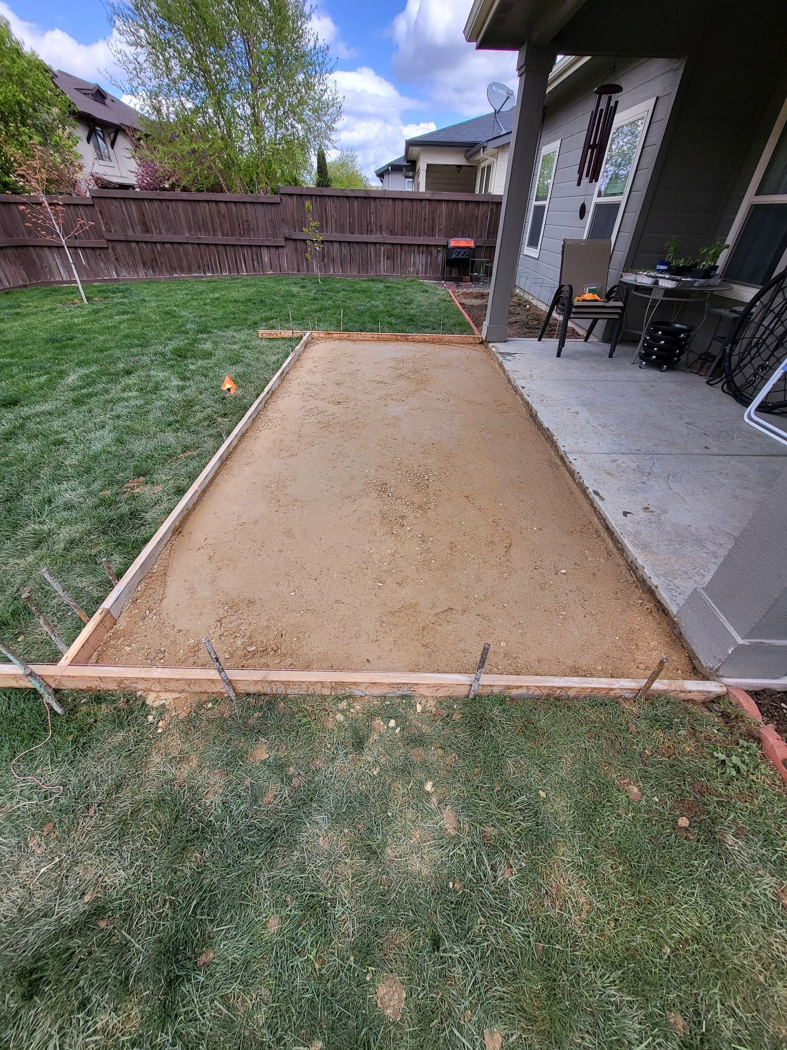 Clean concrete driveway in front of garage, installed by Waypoint Concrete in Boise, ID.