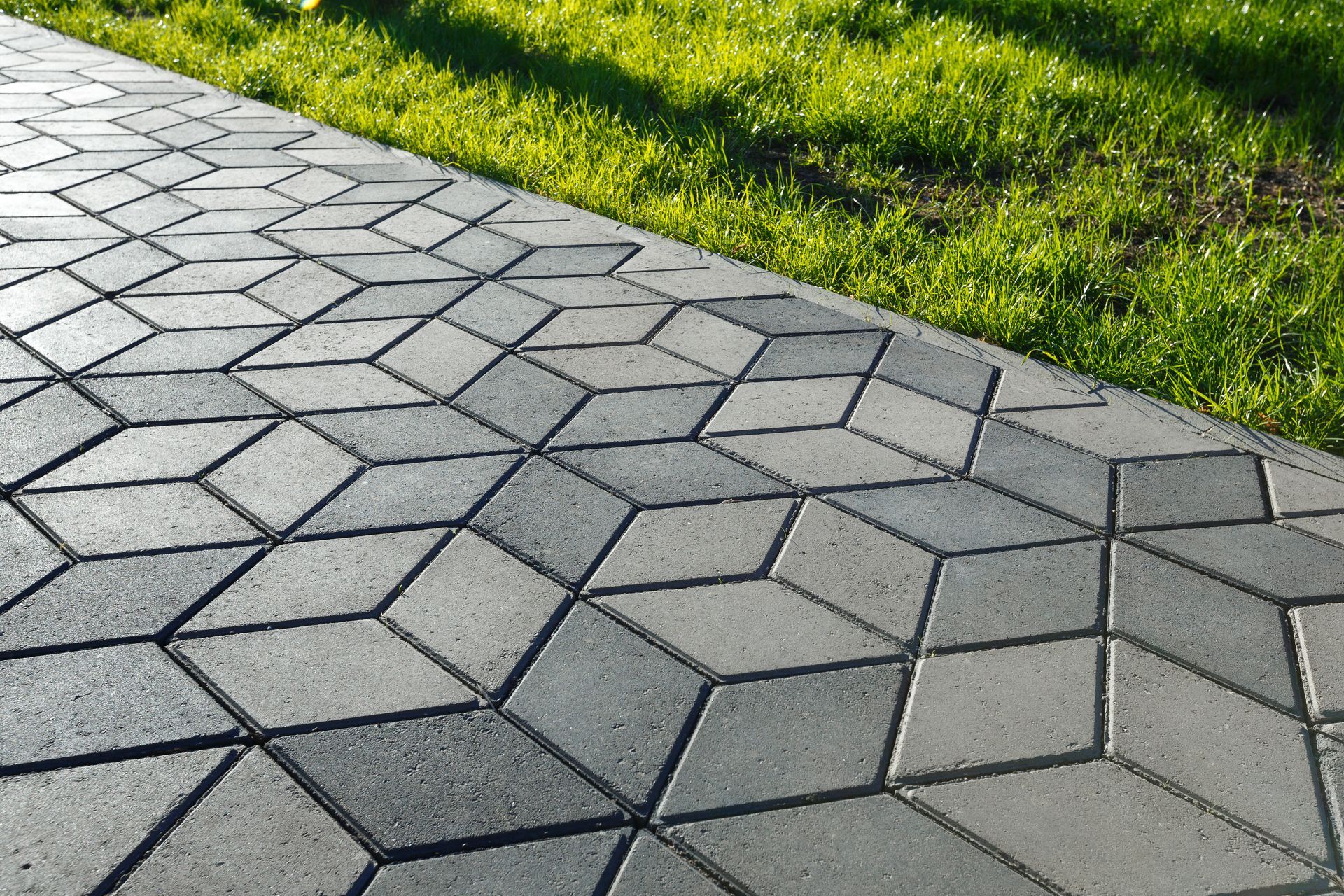Waypoint Concrete installed a stamped concrete sidewalk with angled paver-style pattern in Caldwell, Idaho.
