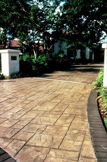 Waypoint Concrete installed a stamped and stained concrete driveway with curved edging in Star, Idaho.