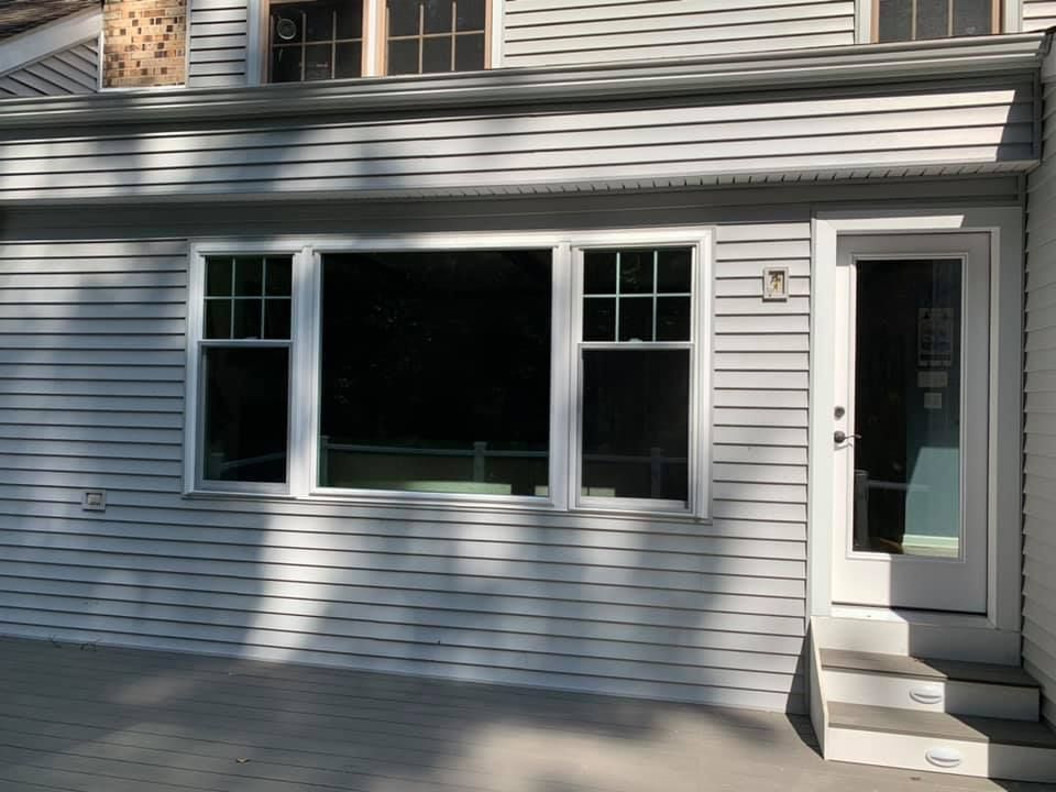 A white house with a white door and stairs