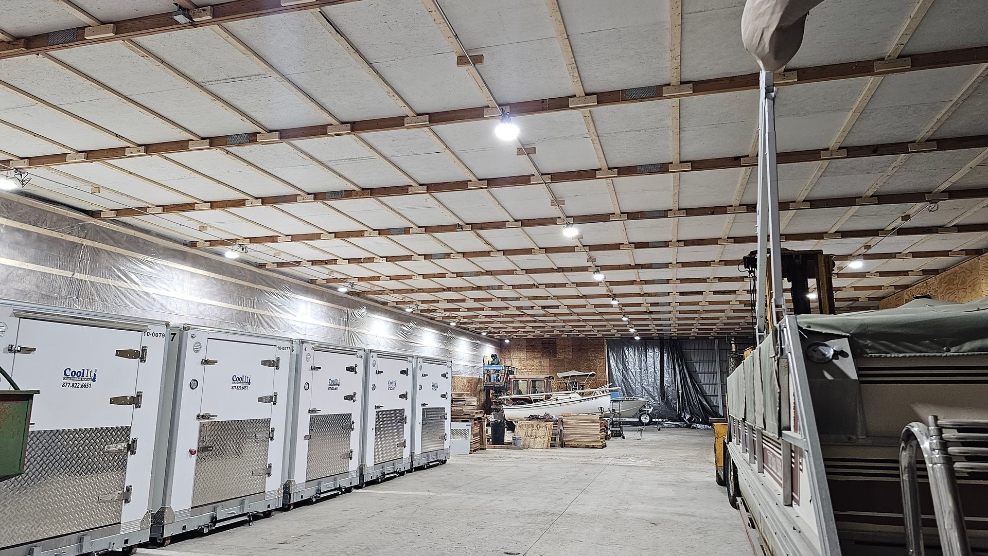 A large warehouse with a lot of boxes in it