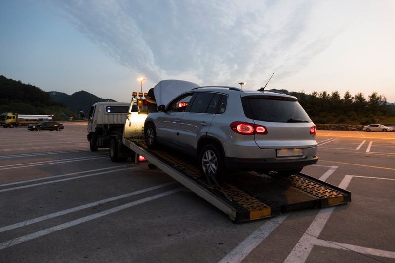 Silver SUV on a Tow Truck — Mid City Smash Repairs in Dubbo, NSW