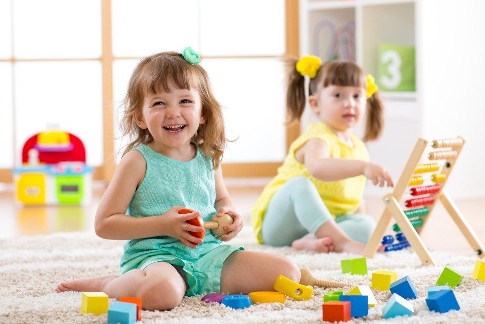 Girls Play Logical Toy Learning Shapes, Arithmetic And Colors — Grandma Rosie’s Quality Long Day Care In Wollongong, NSW