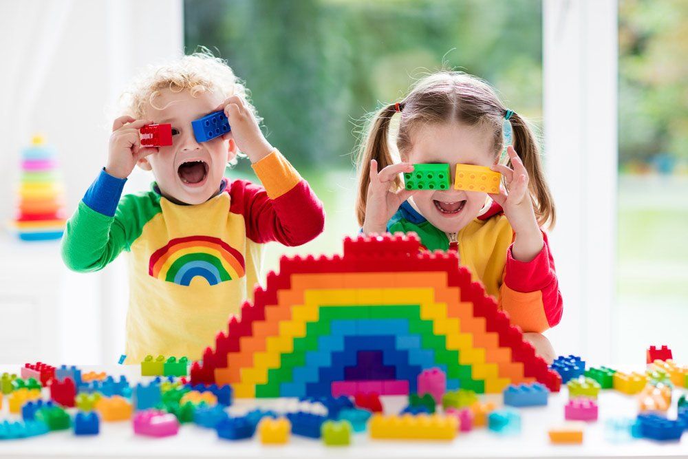 Little Girl And Curly-Haired Boy With Educational Toy Blocks — Grandma Rosie’s Quality Long Day Care In Wollongong, NSW