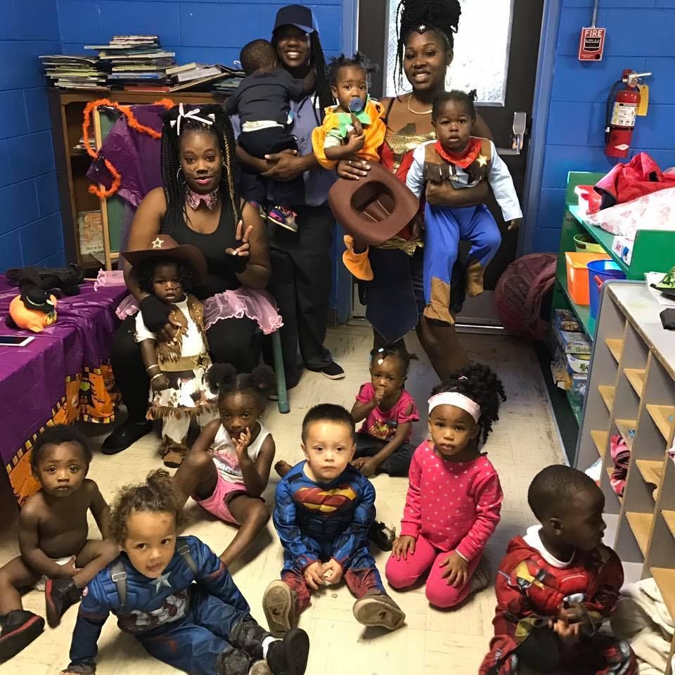 A group of children are posing for a picture in a room