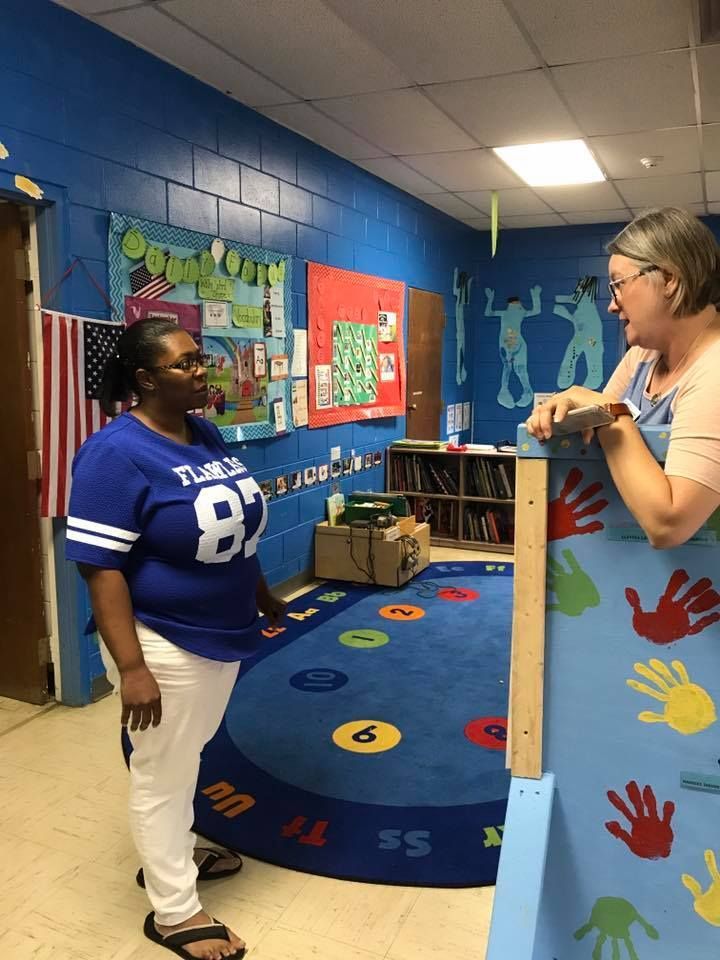 A woman in a blue shirt with the number 87 on it