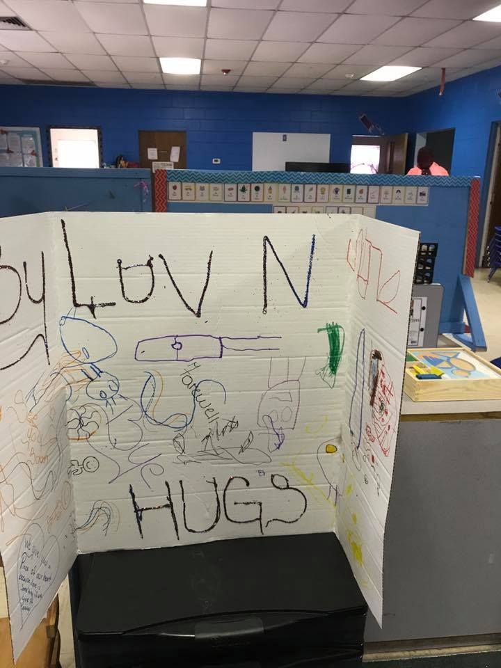 A room with a sign that says hugs on it