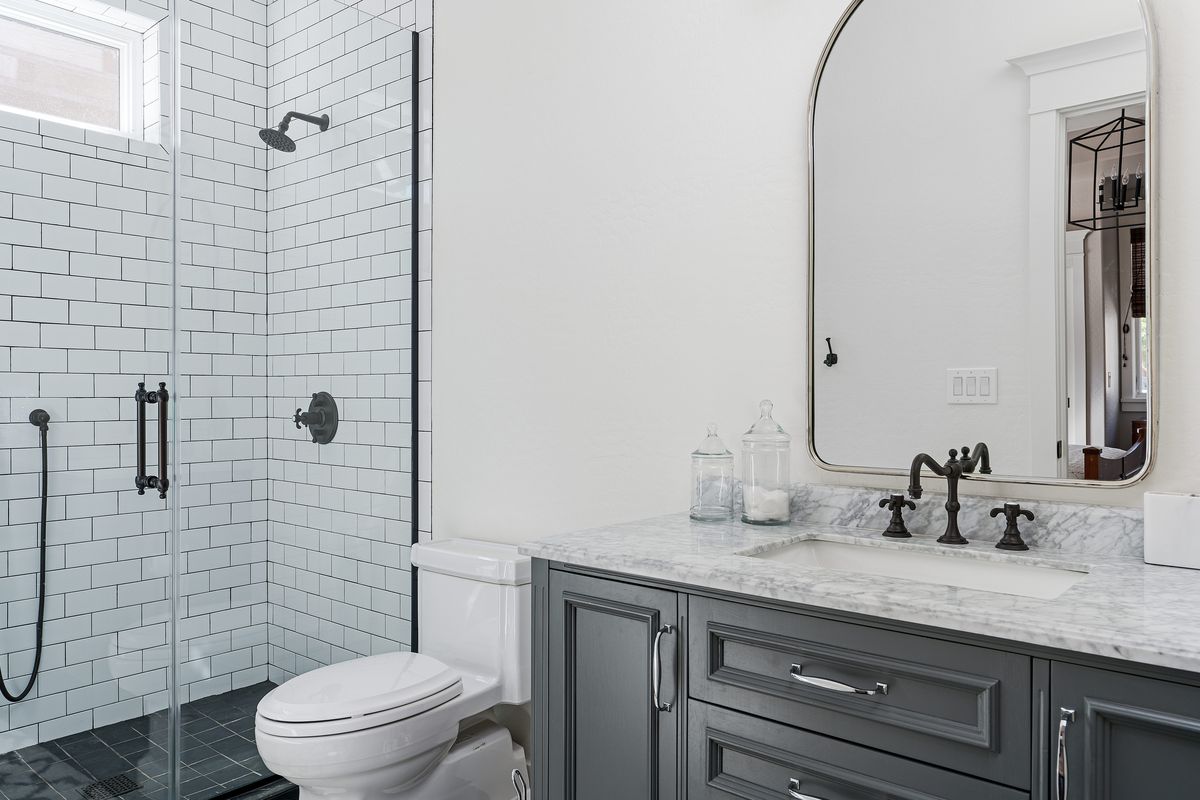 a bathroom with two sinks and a bathtub