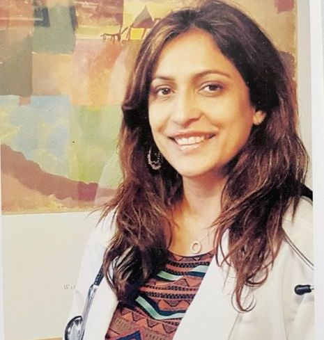 doctor consulting with pleased patient