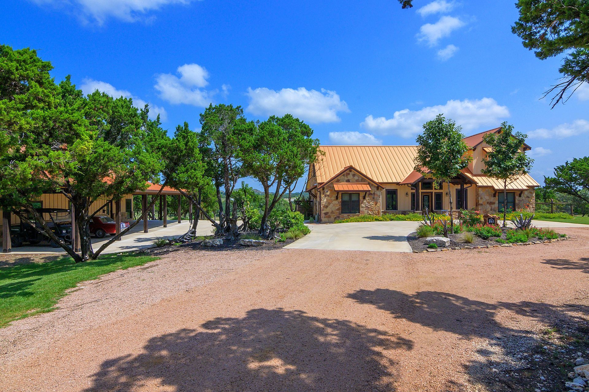 A large house with a lot of trees in front of it