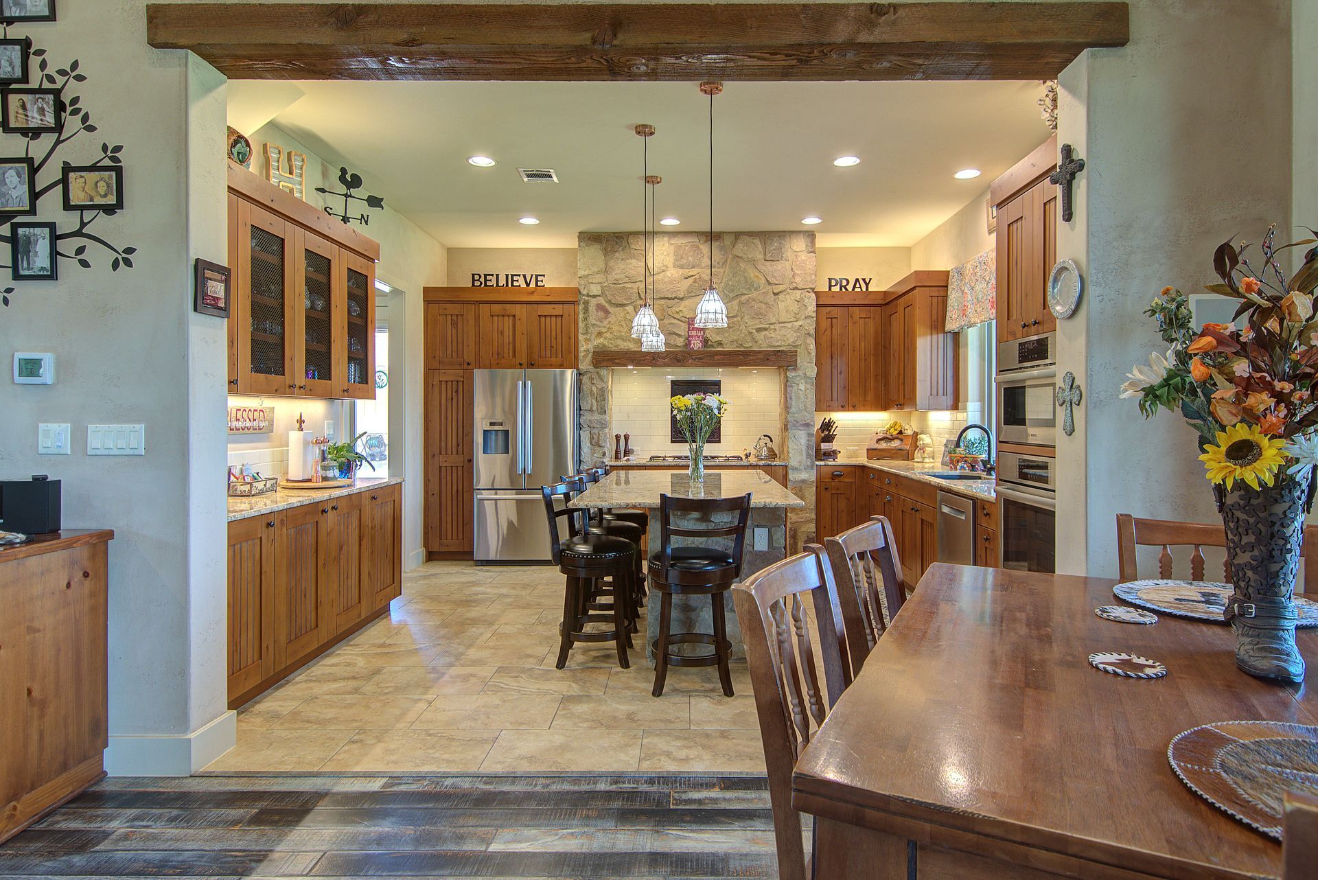A kitchen and dining room in a house with a table and chairs.