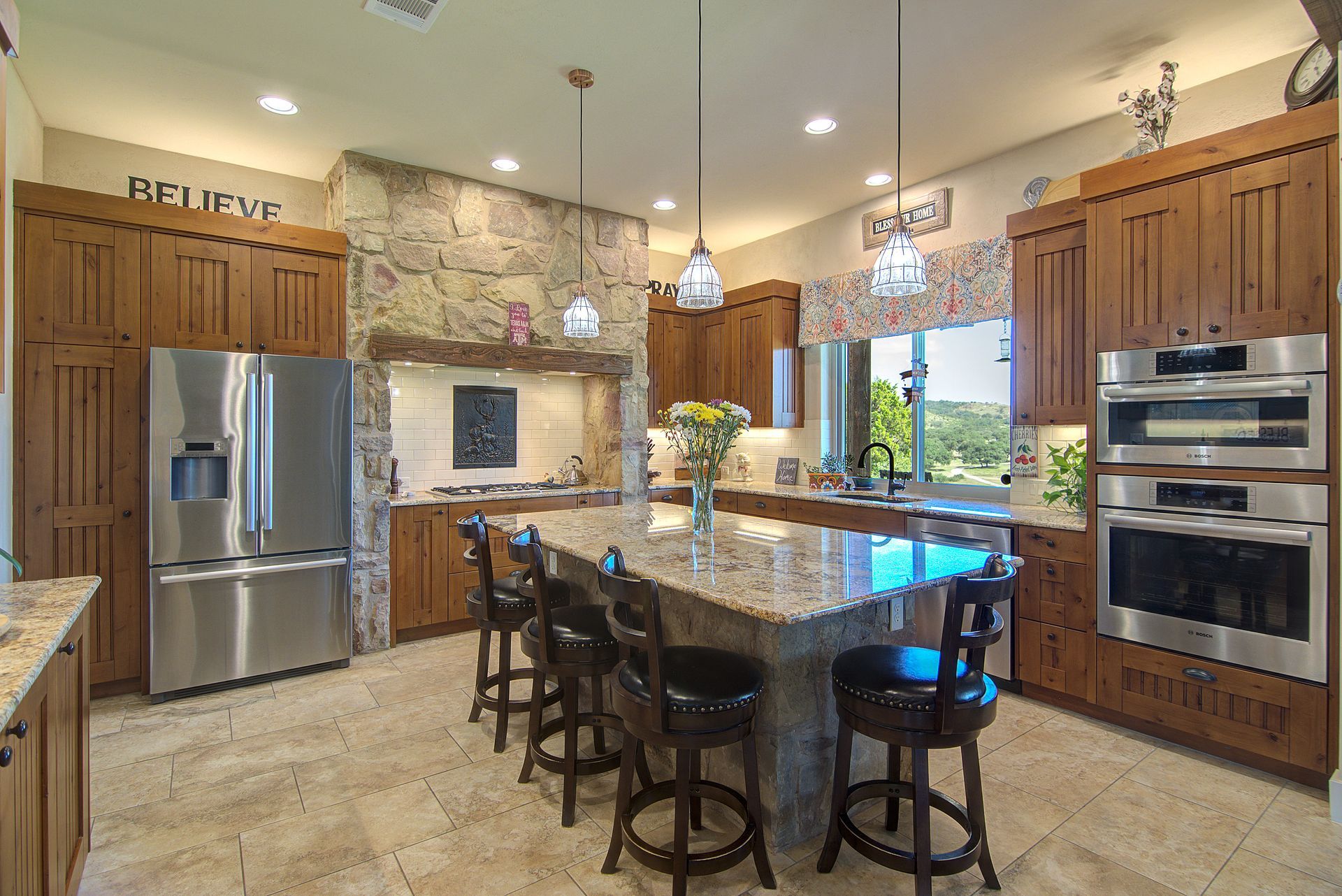A kitchen with stainless steel appliances and a large island