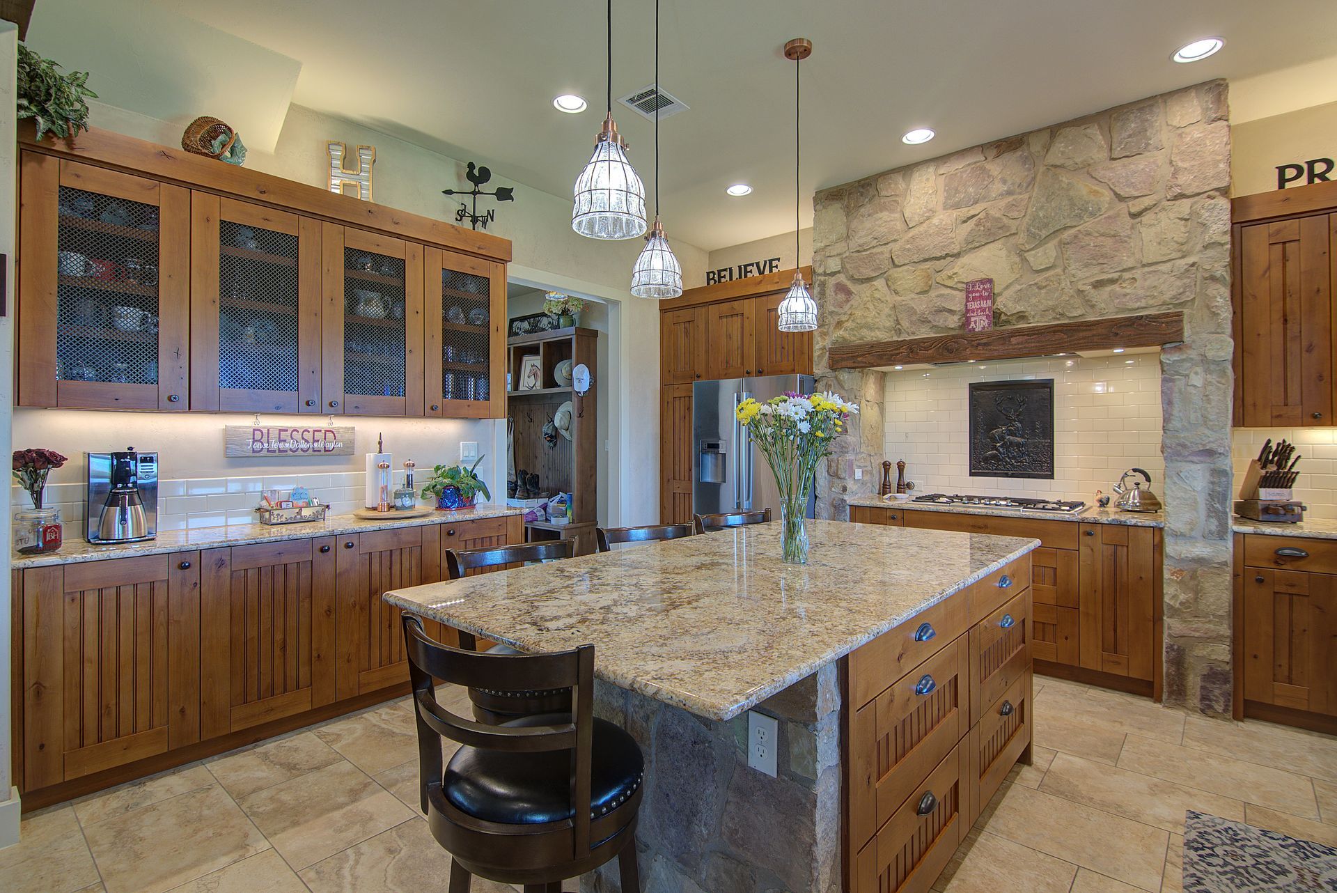 A kitchen with a large island and wooden cabinets