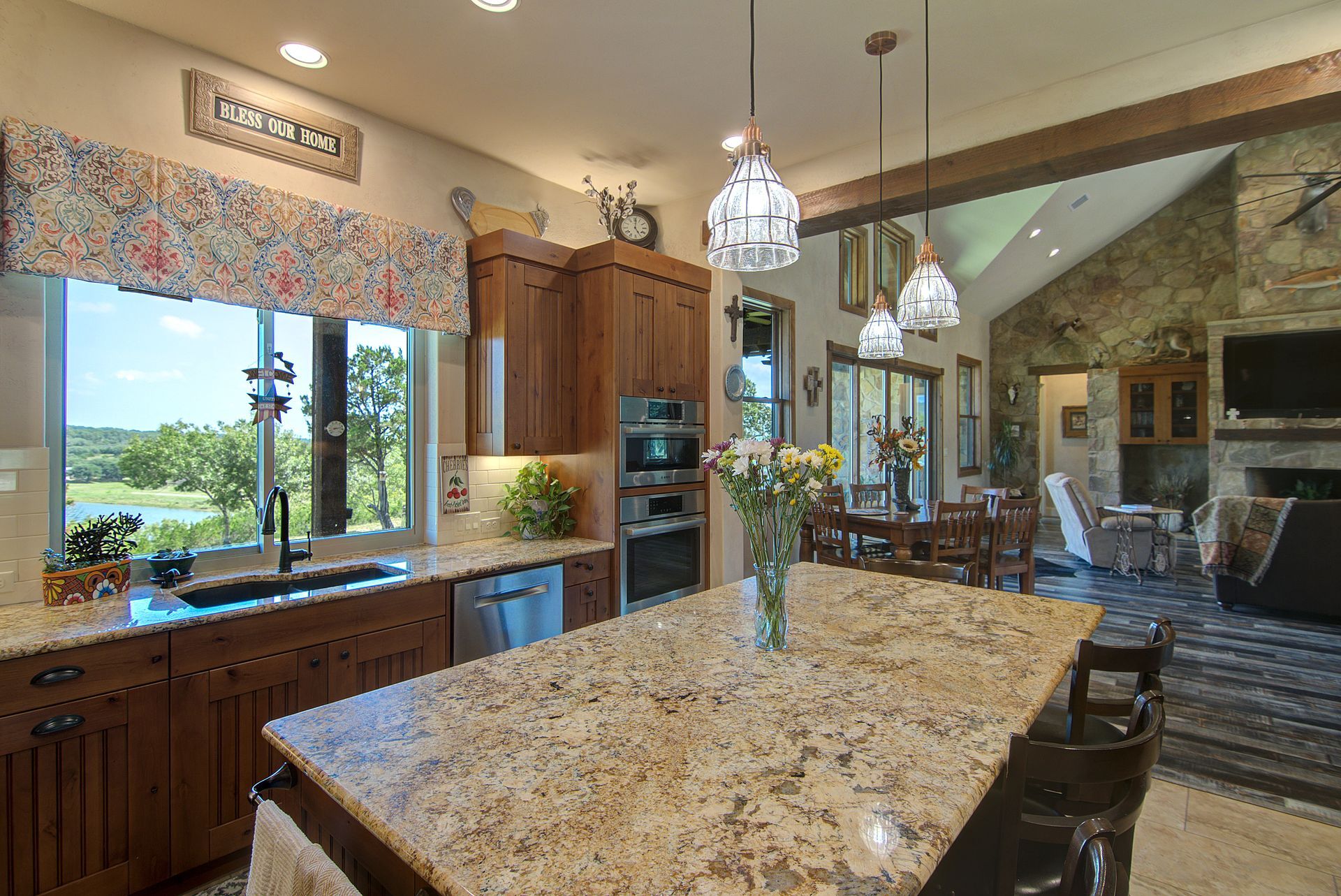 A kitchen with granite counter tops and a large island.