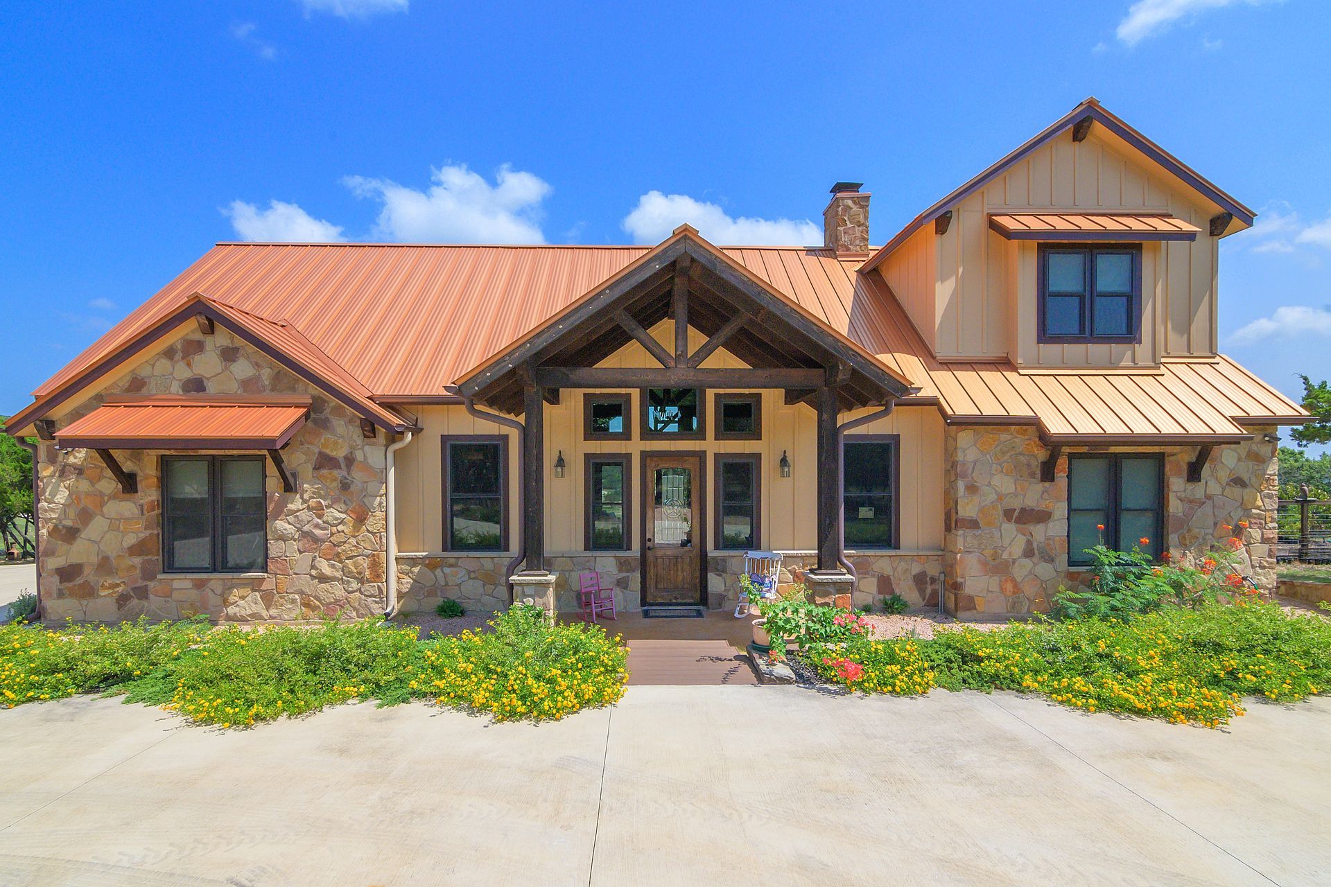 A large house with a copper roof is for sale.