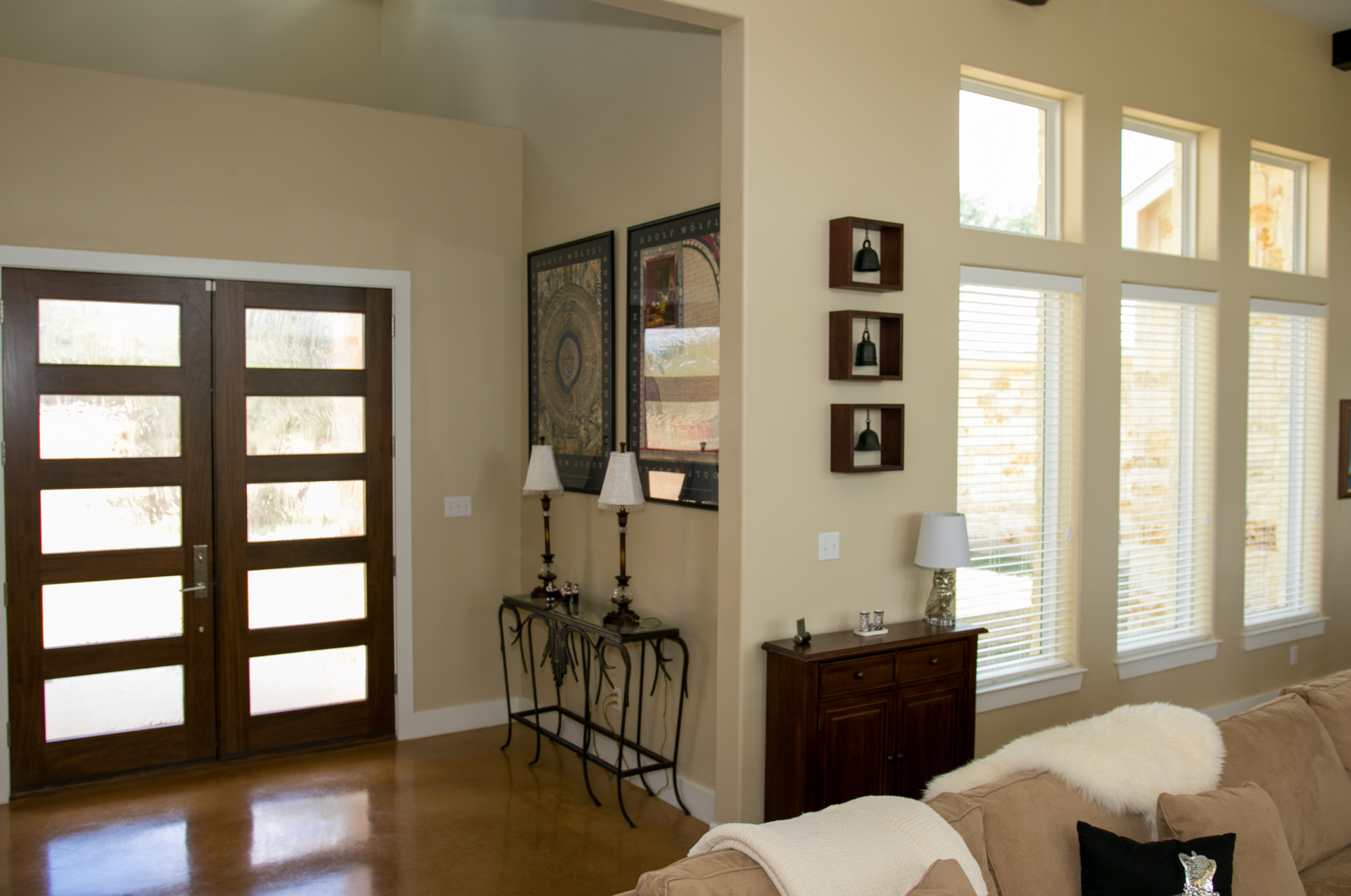 A living room with a couch and lots of windows