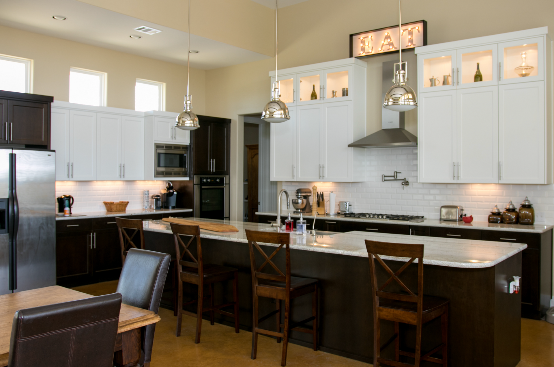 A kitchen with a large island and a sign that says toast