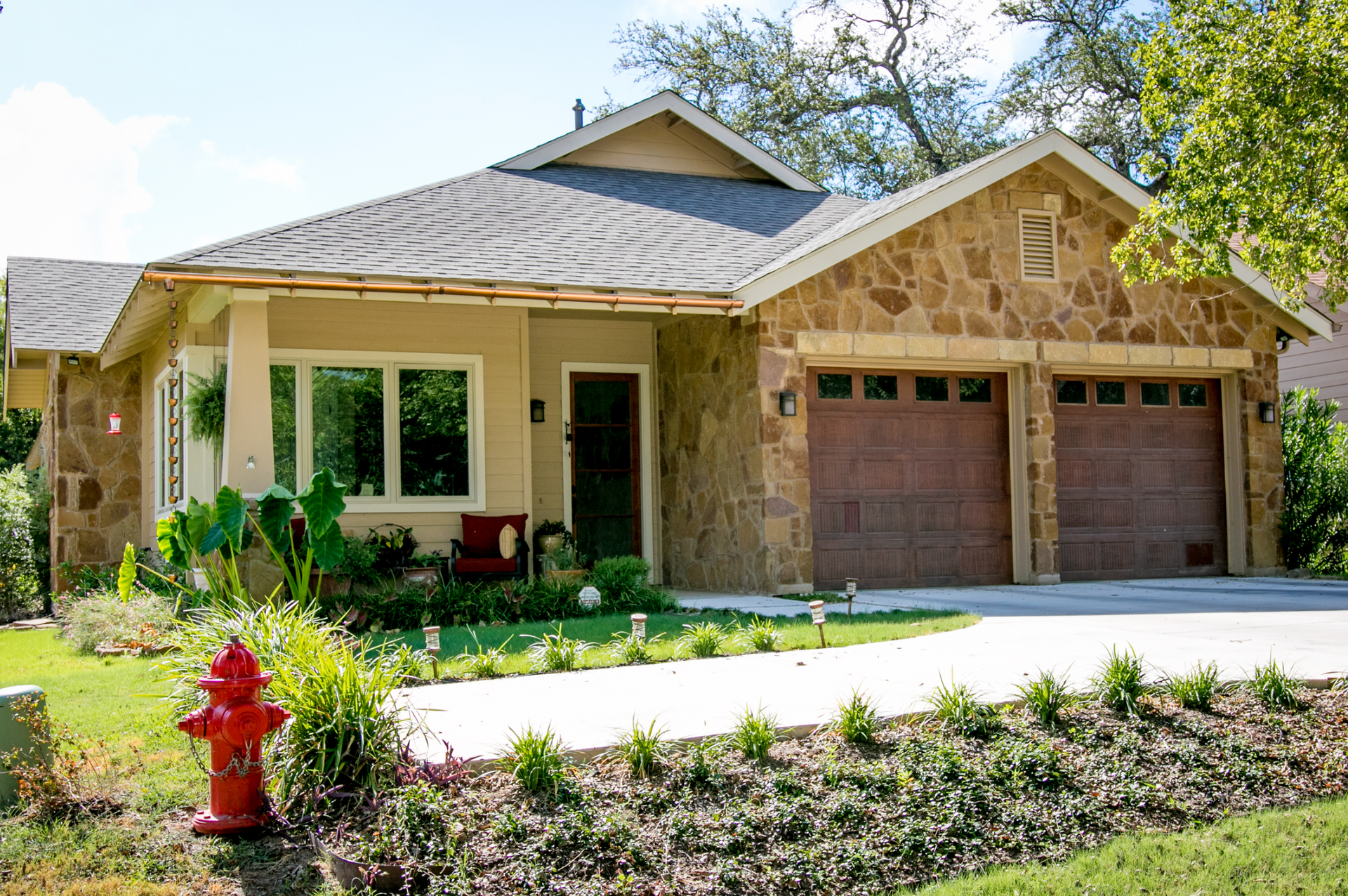 A house with a fire hydrant in front of it