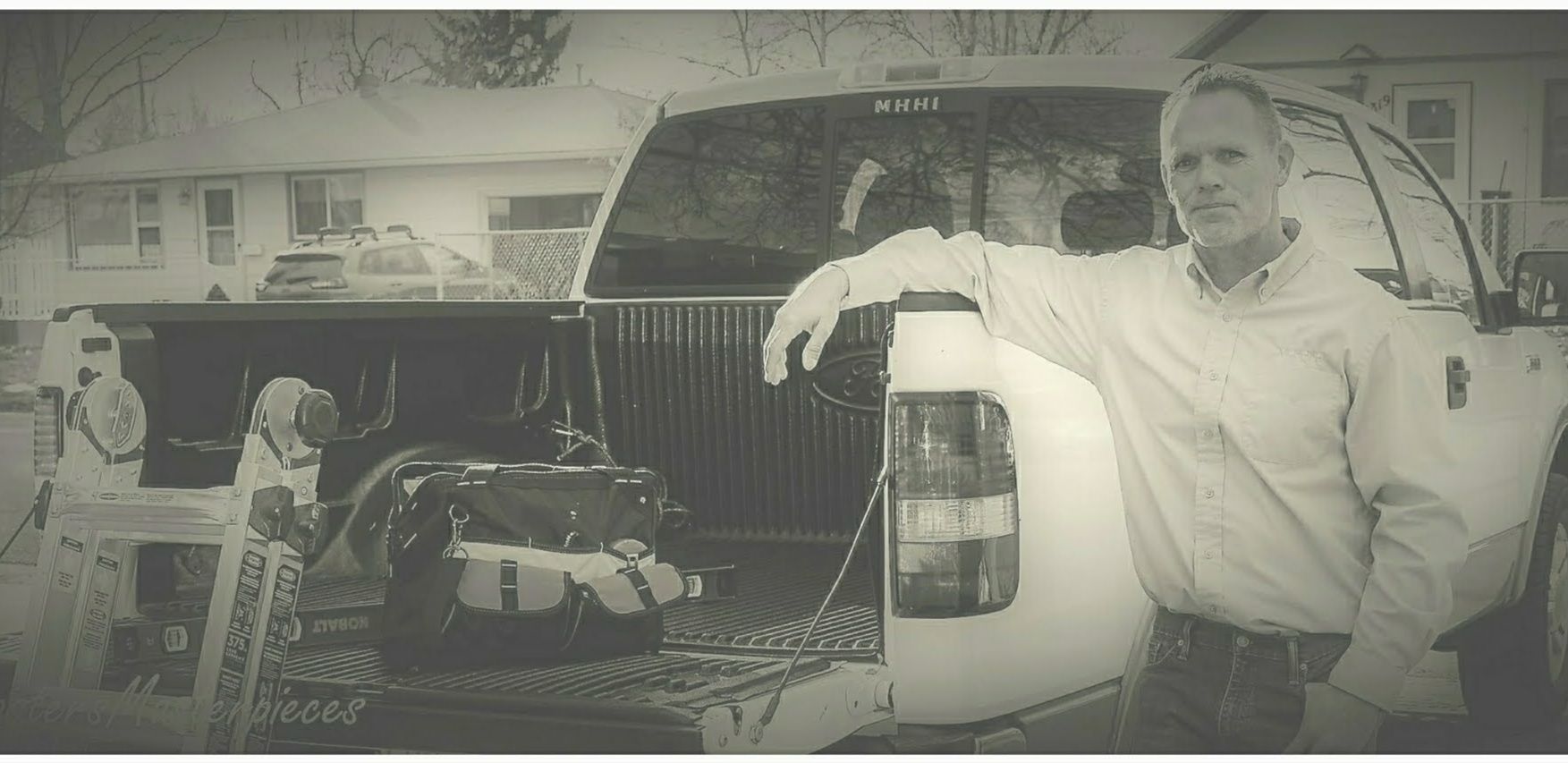 Jeff Durham standing next to a truck holding a bottle of milk.