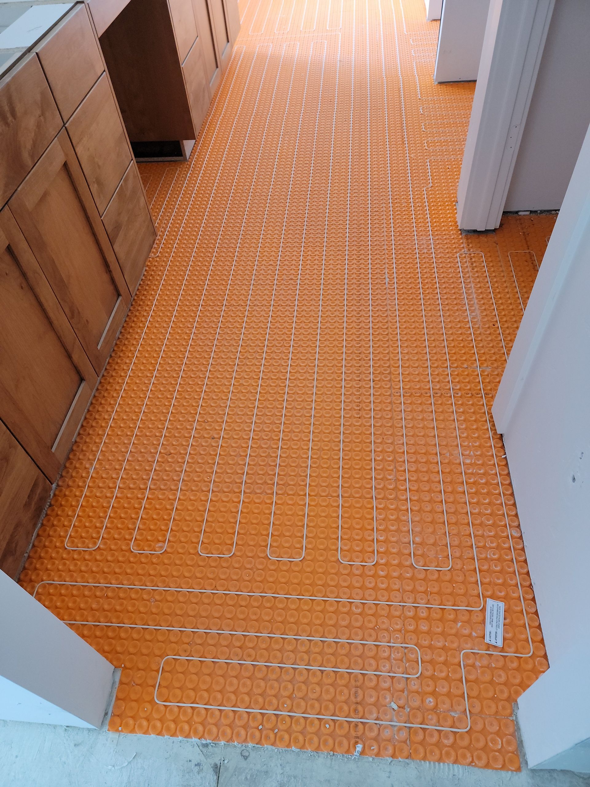 A kitchen floor with a lot of lines on it