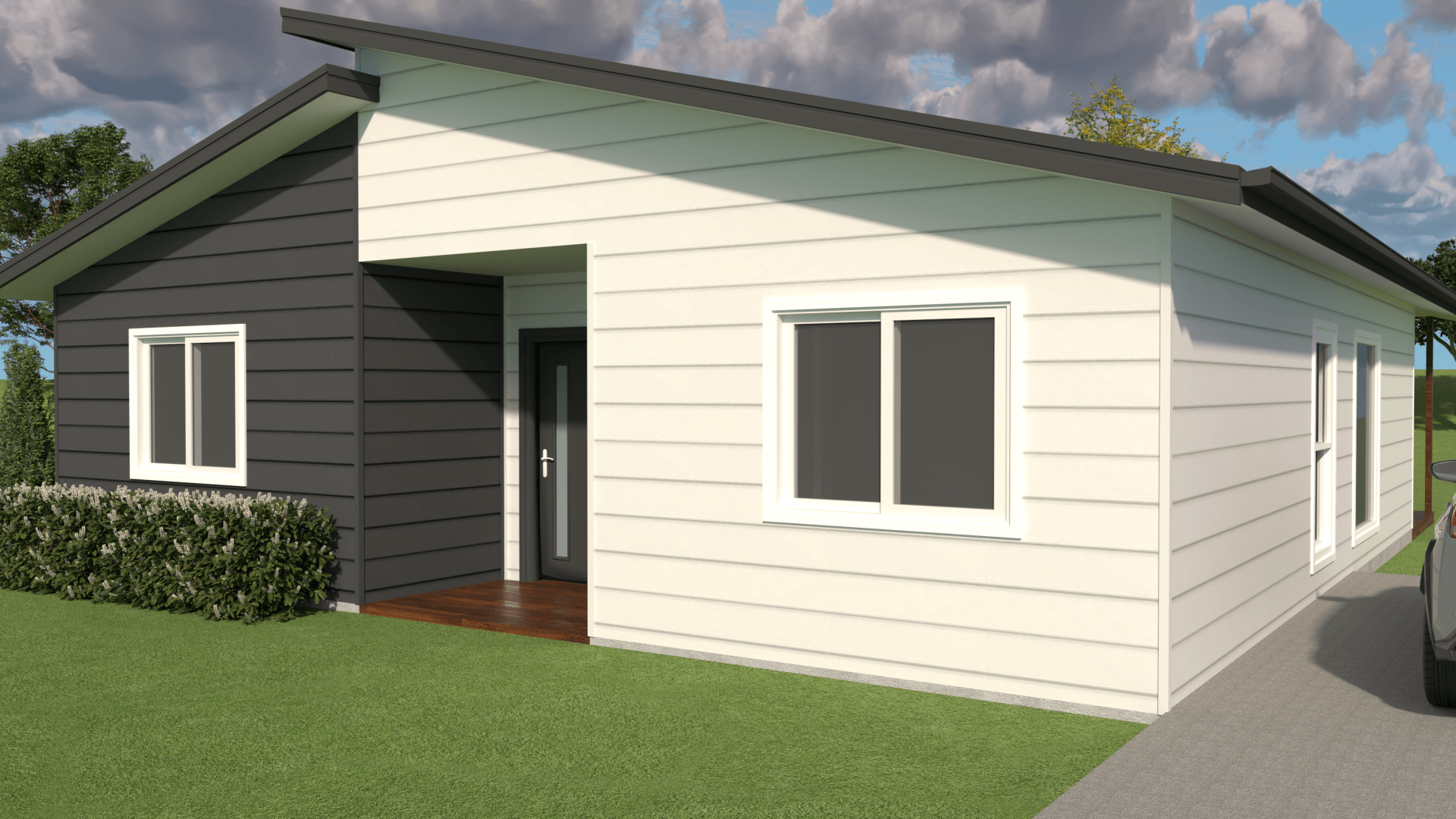 Modern house exterior with dark grey and white siding, angled roof, and windows.