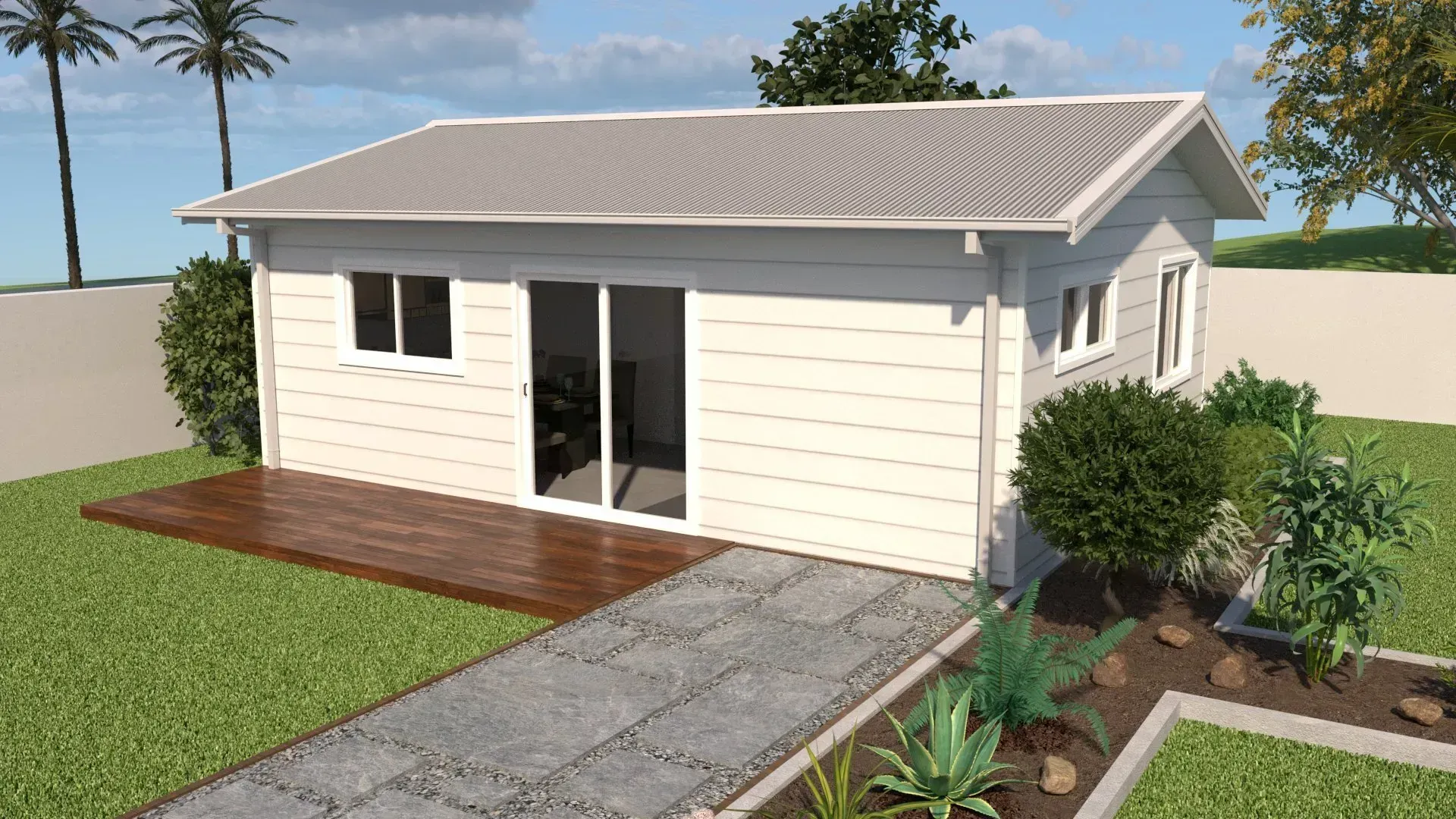 Small white house with gray roof, wooden deck, and stone path on a grassy lawn with plants and trees.
