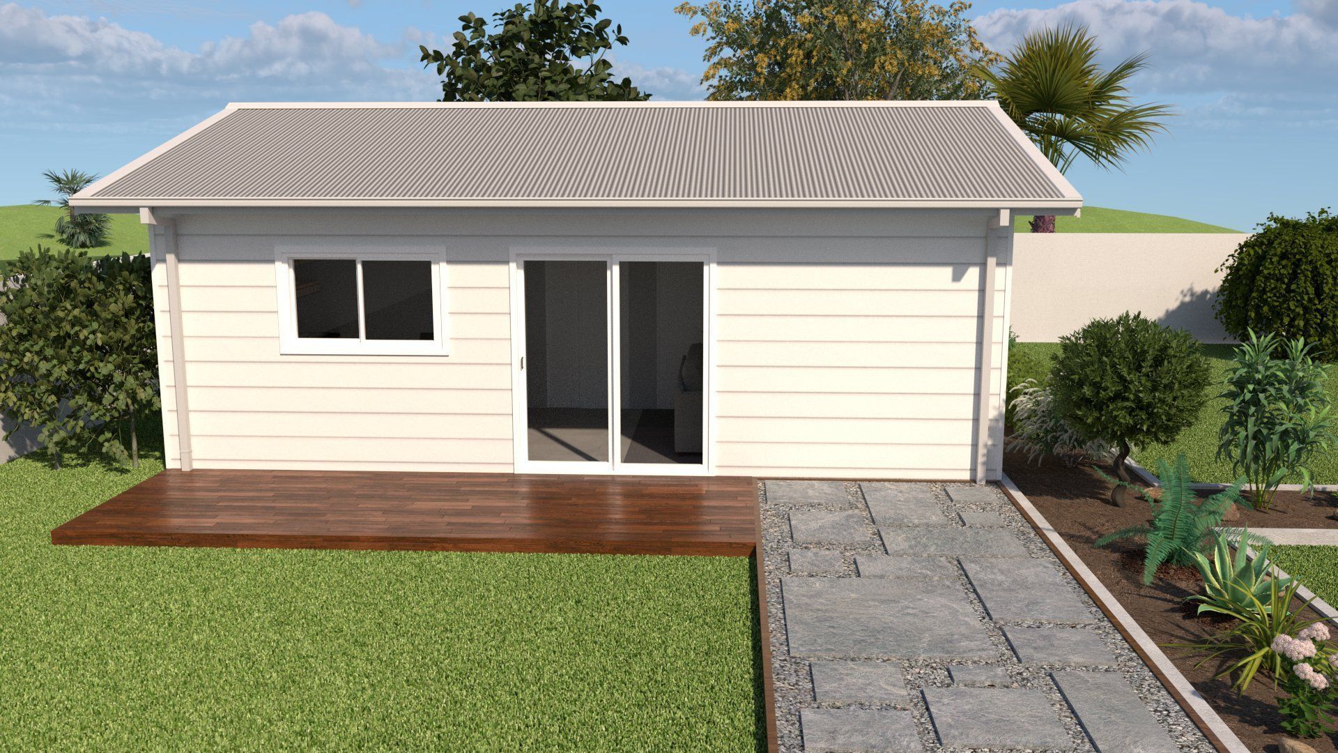 Small white building with a deck and stone path in a yard, surrounded by greenery.