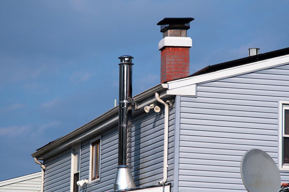 A House With A Chimney On The Side Of It — Central West Budget Tree Services in Dubbo, NSW