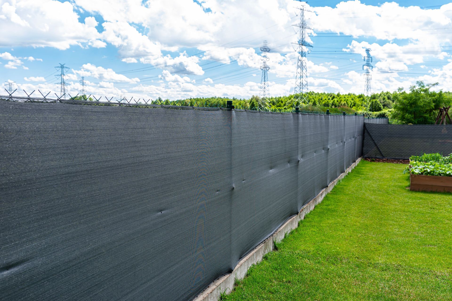 Residential chain link privacy fence with wind screens installation in Tampa, FL