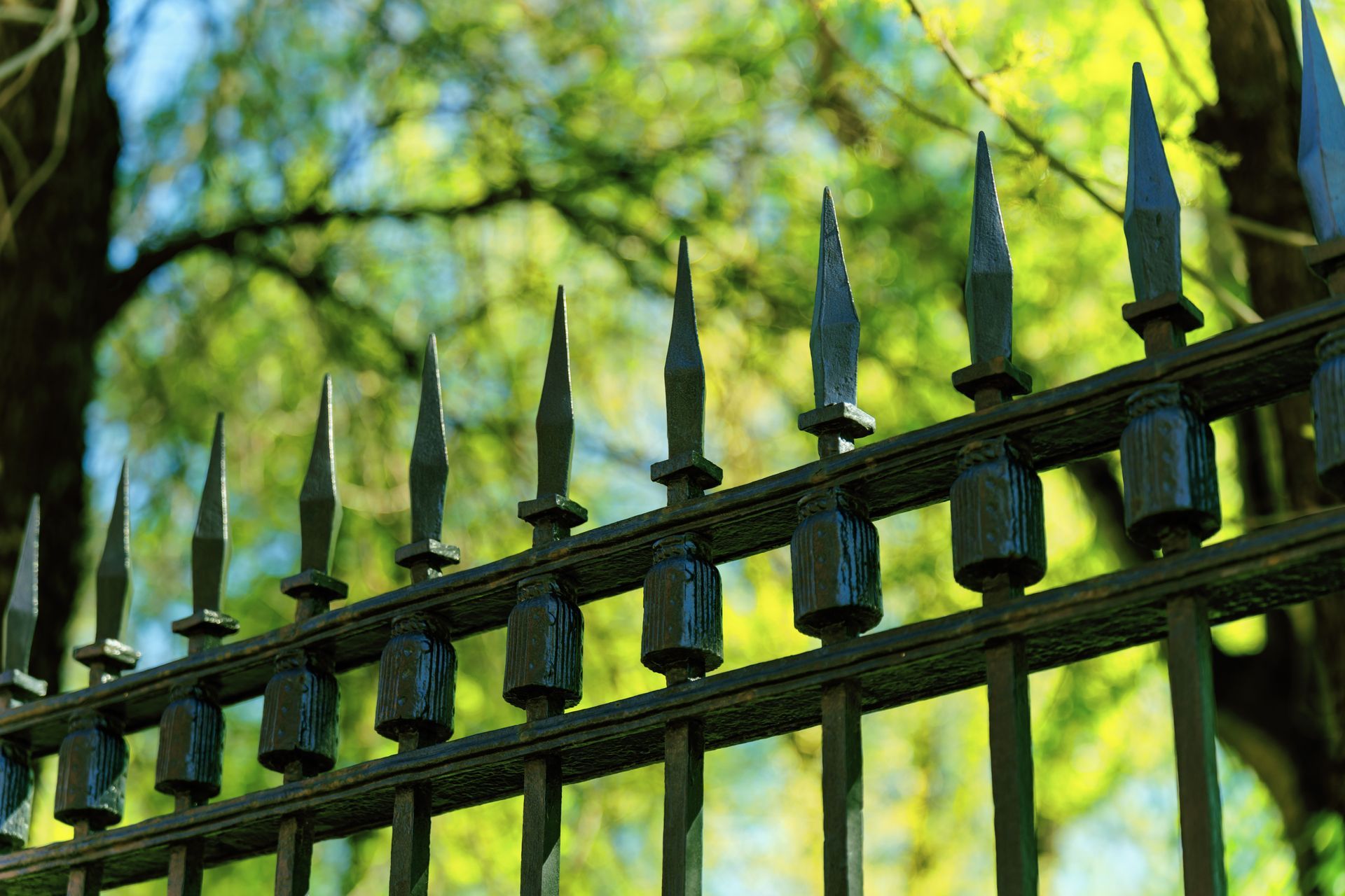 Black commercial aluminum spear top fence installation in Tampa, FL
