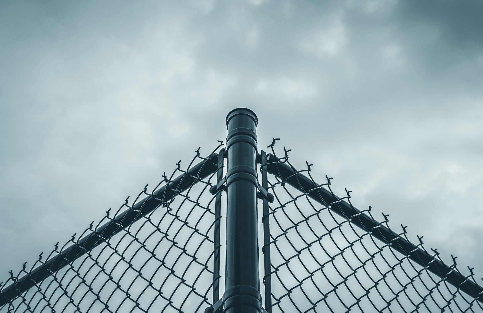 Commercial black coated chain link fence installation in Tampa, FL