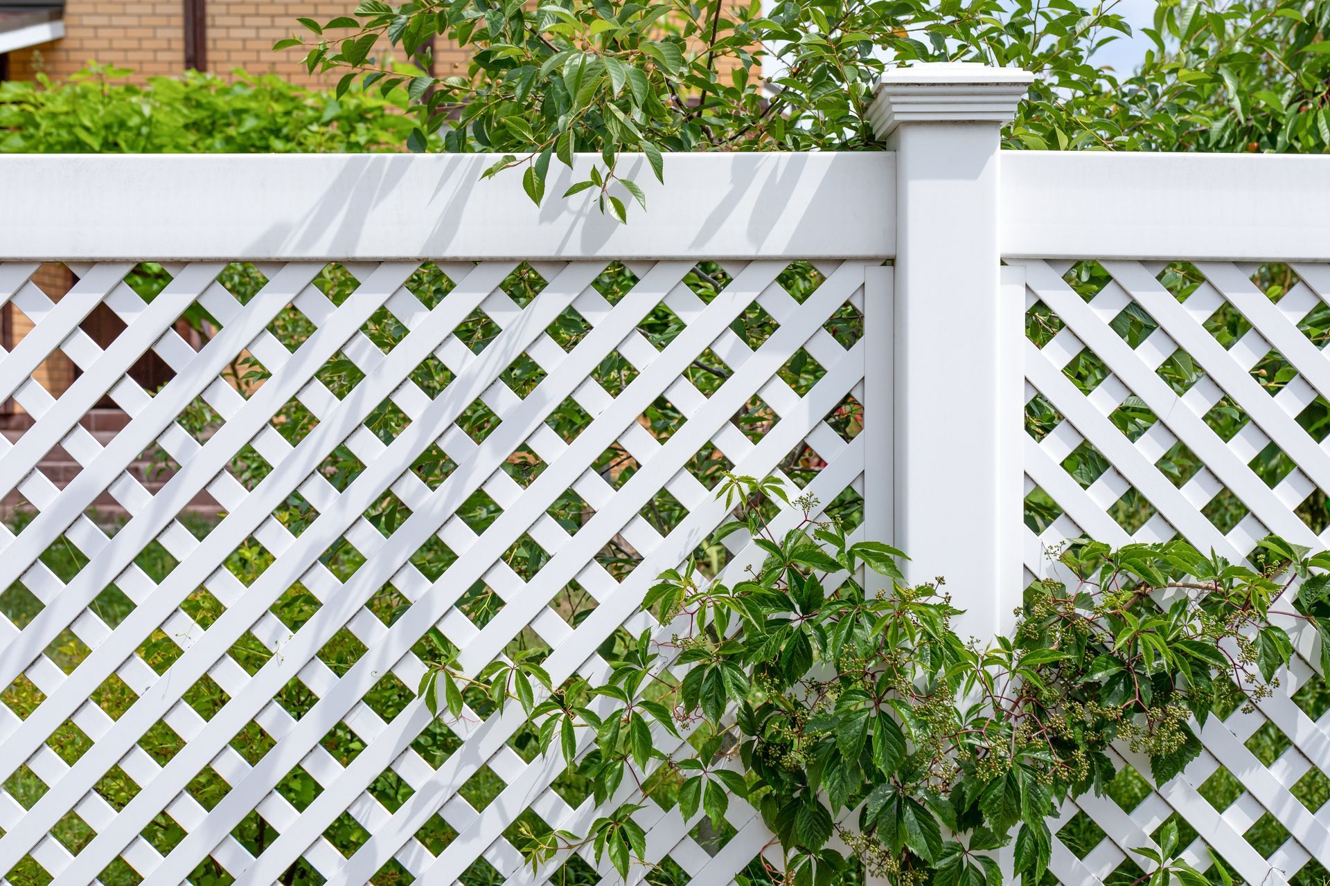 White commercial decorative vinyl fence installation in Tampa, FL