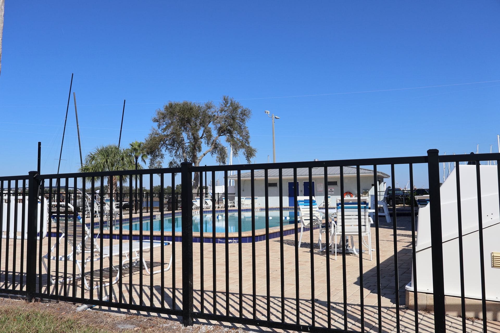 Commercial aluminum fence installation around a pool in Tampa, FL