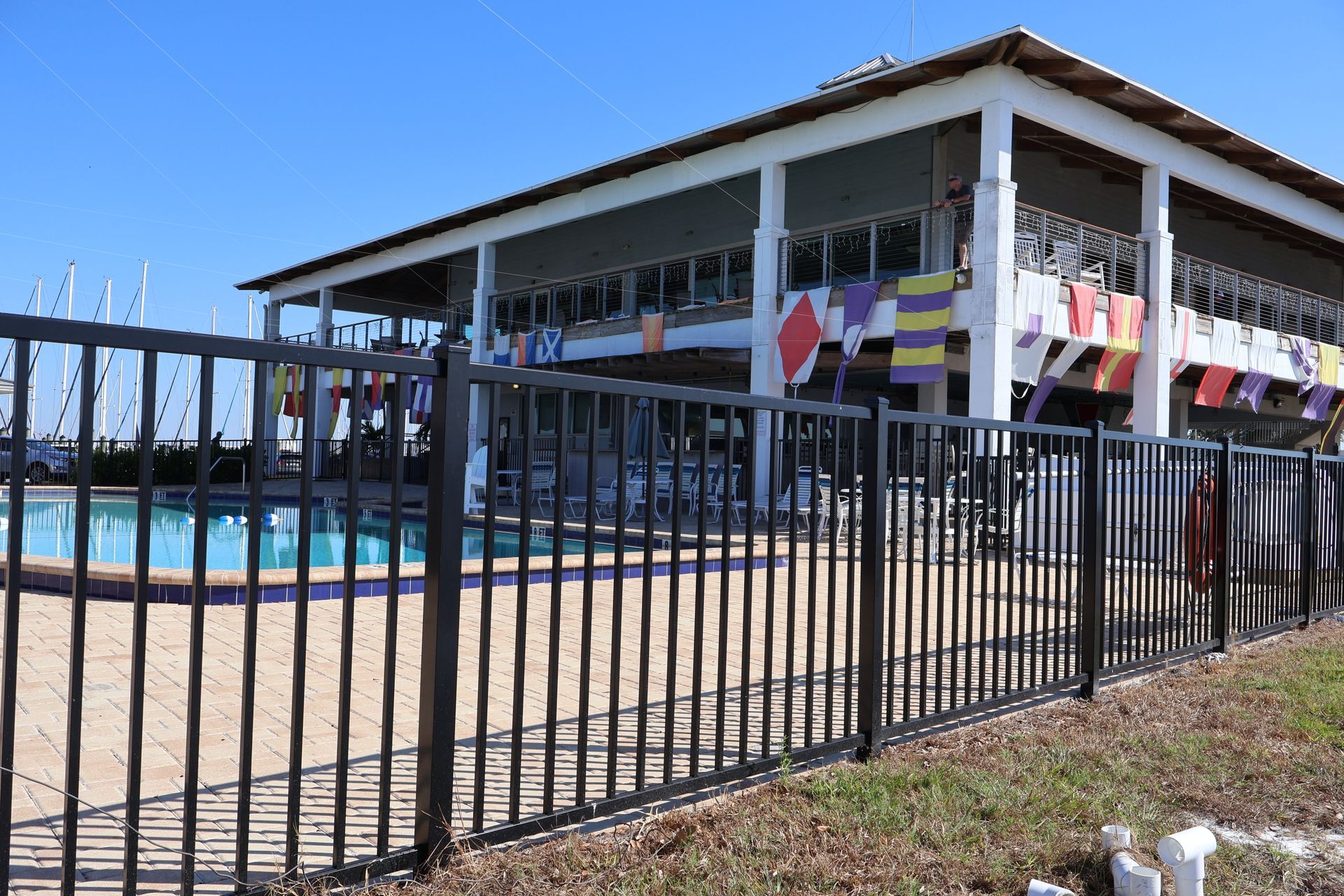 Commercial aluminum fence installation around a pool in Tampa, FL