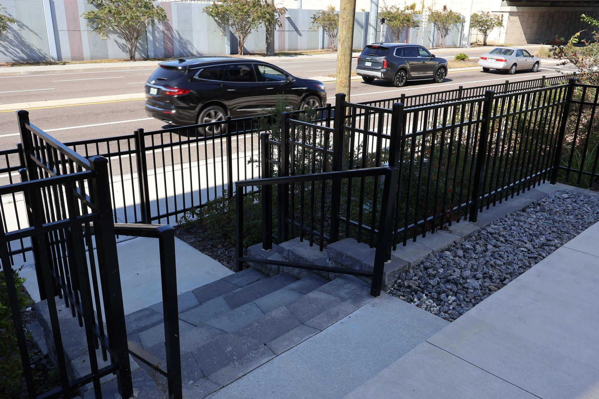 Commercial aluminum fence installation with stair railing in Tampa, FL