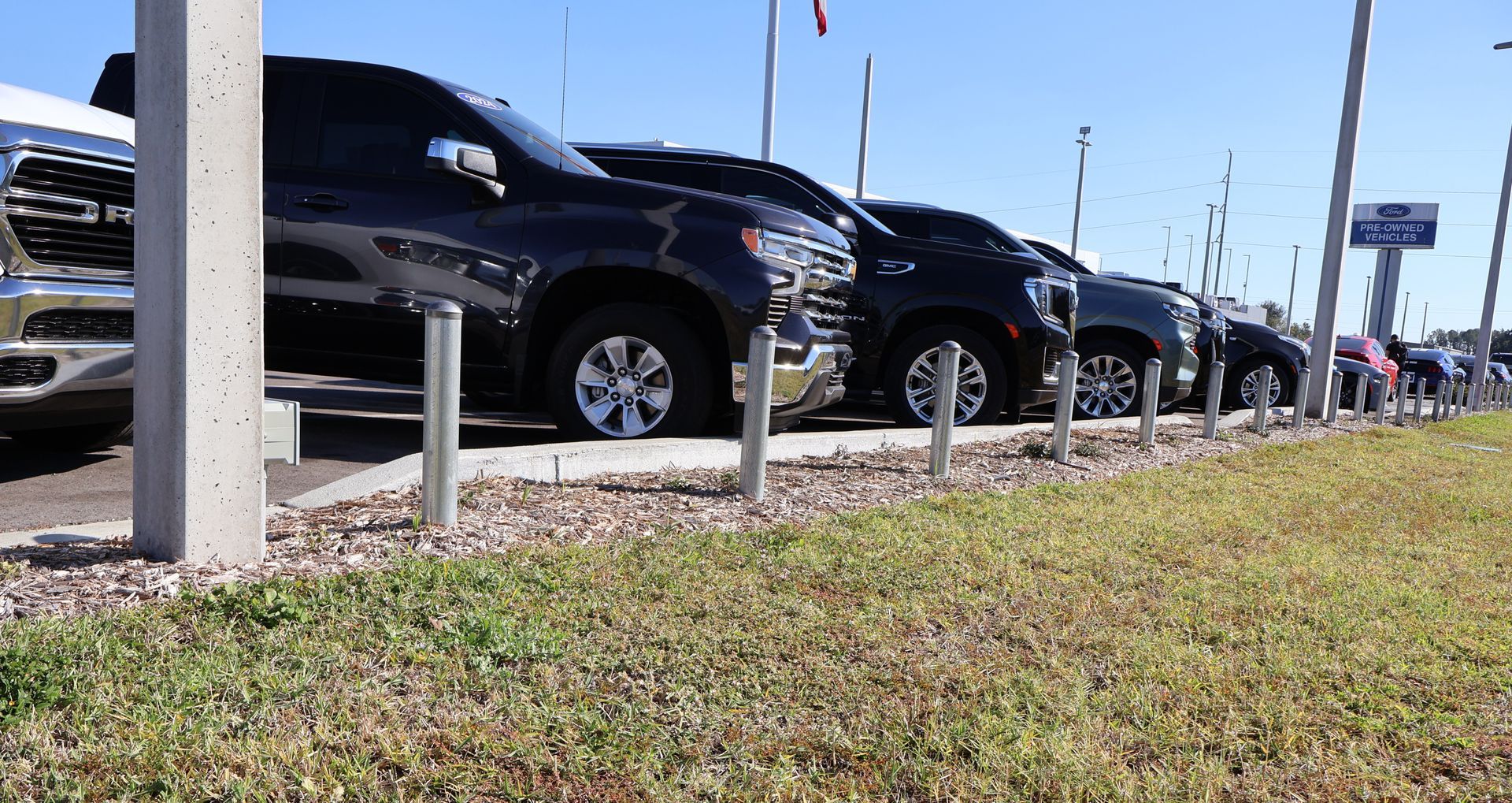 Commercial aluminum bollards installation at a Lexus car dealership in Tampa, FL