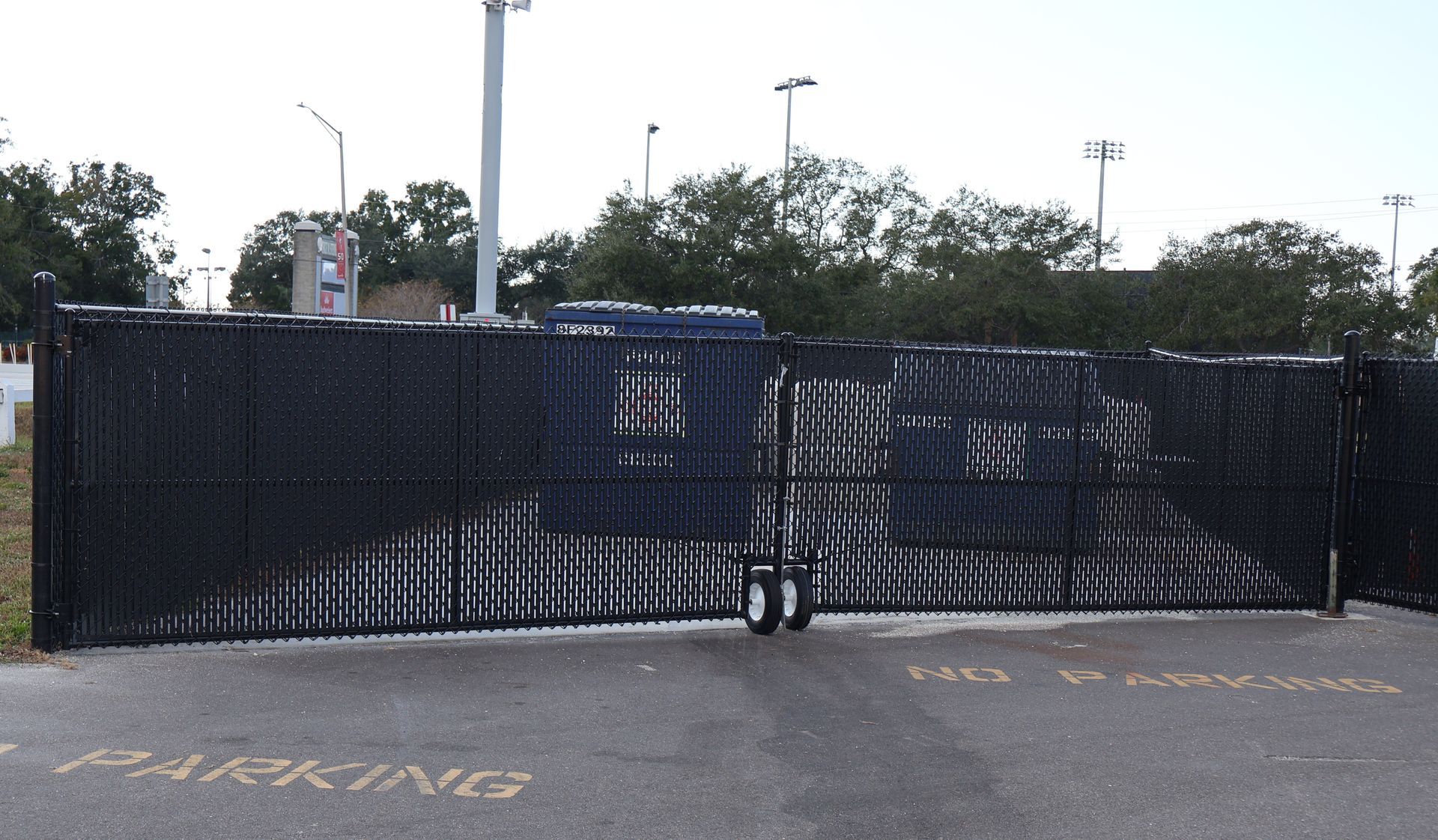 Commercial chain link dumpster enclosure in Tampa, FL