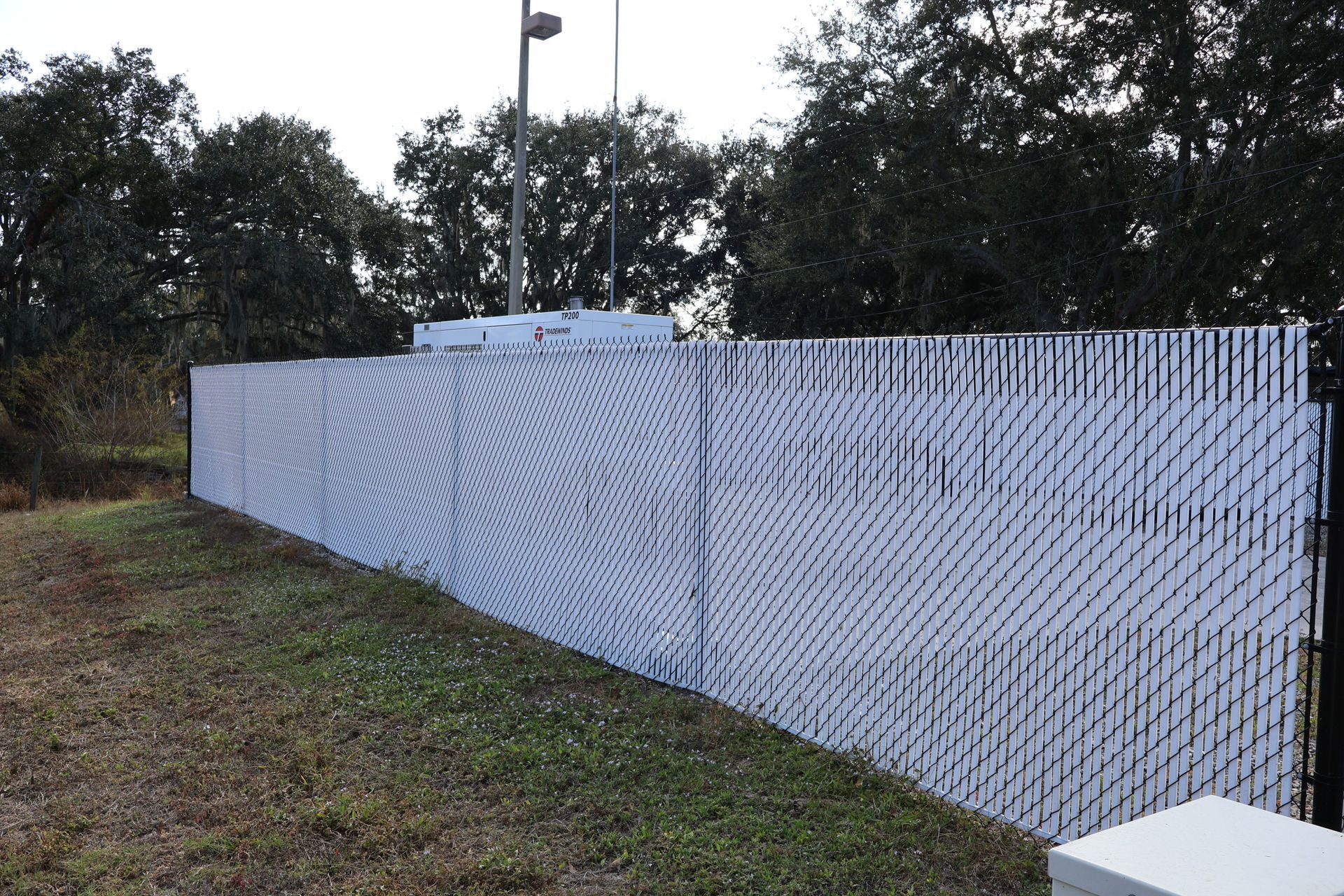 Commercial chain link and white vinyl enclosure in Tampa, FL