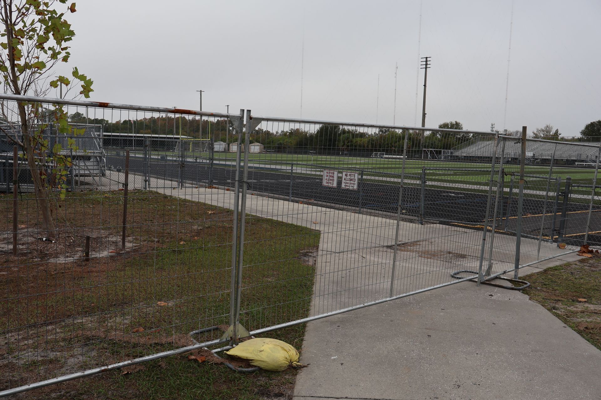 Commercial temporary fence and gate installation at Alonso High School in Tampa, FL